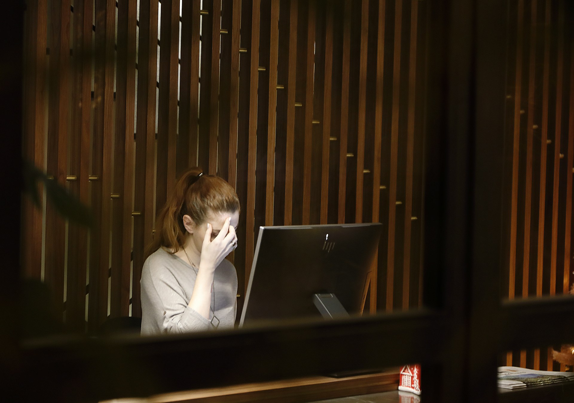 A woman experiencing burnout because of her imposter syndrome and mental health challenges caused by it.