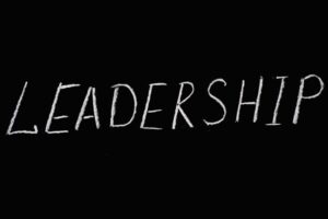 Word Leadership on a black background.