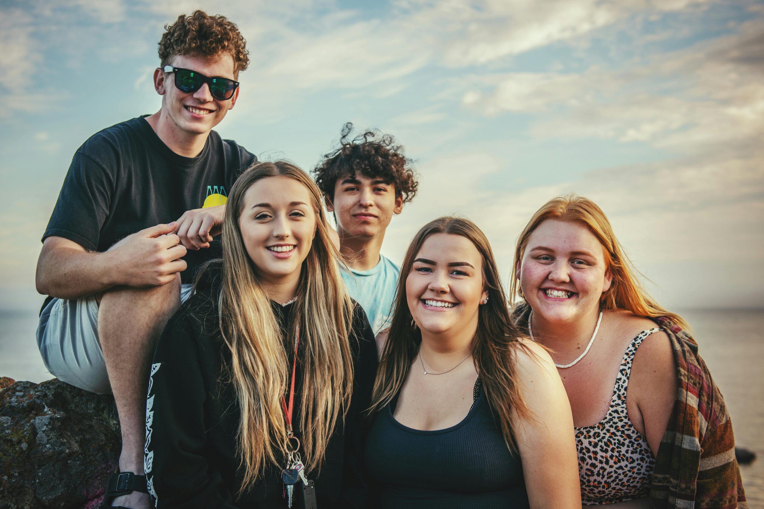 photo of group of friends experiencing Imposter syndrome in relationships