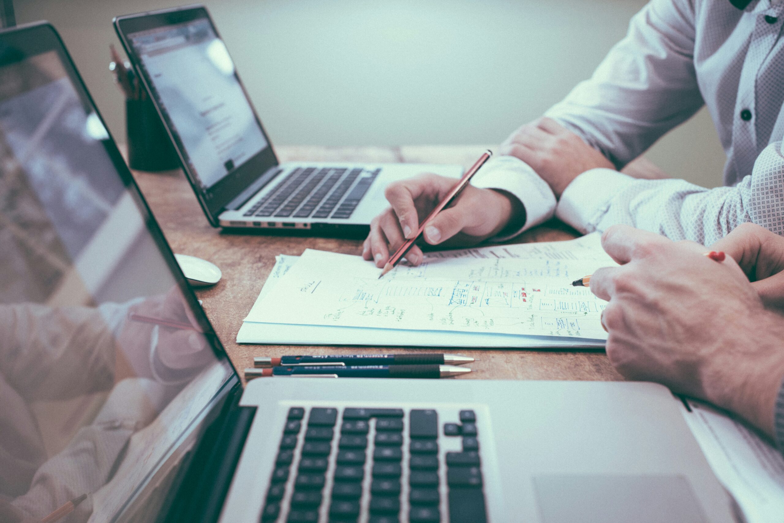 Two men looking at financials, and knowing their Job causing stress and anxiety - needing mens therapy