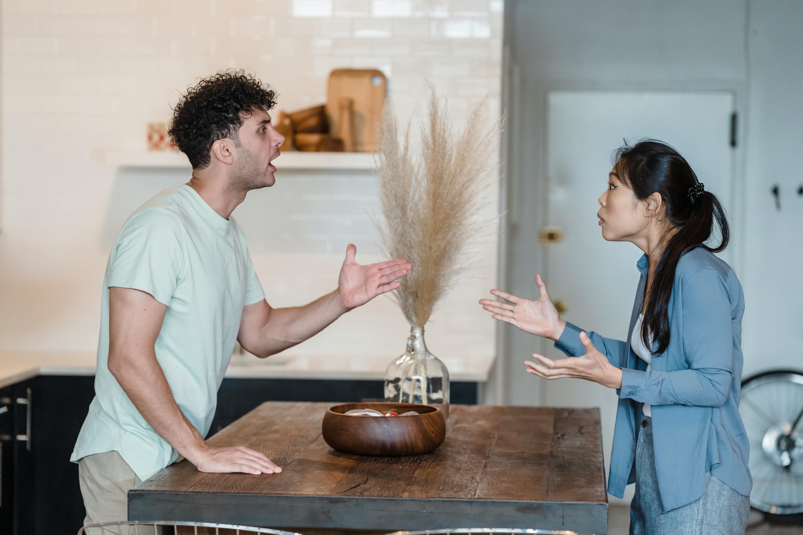 a couple arguing, experiencing different types of gaslighting