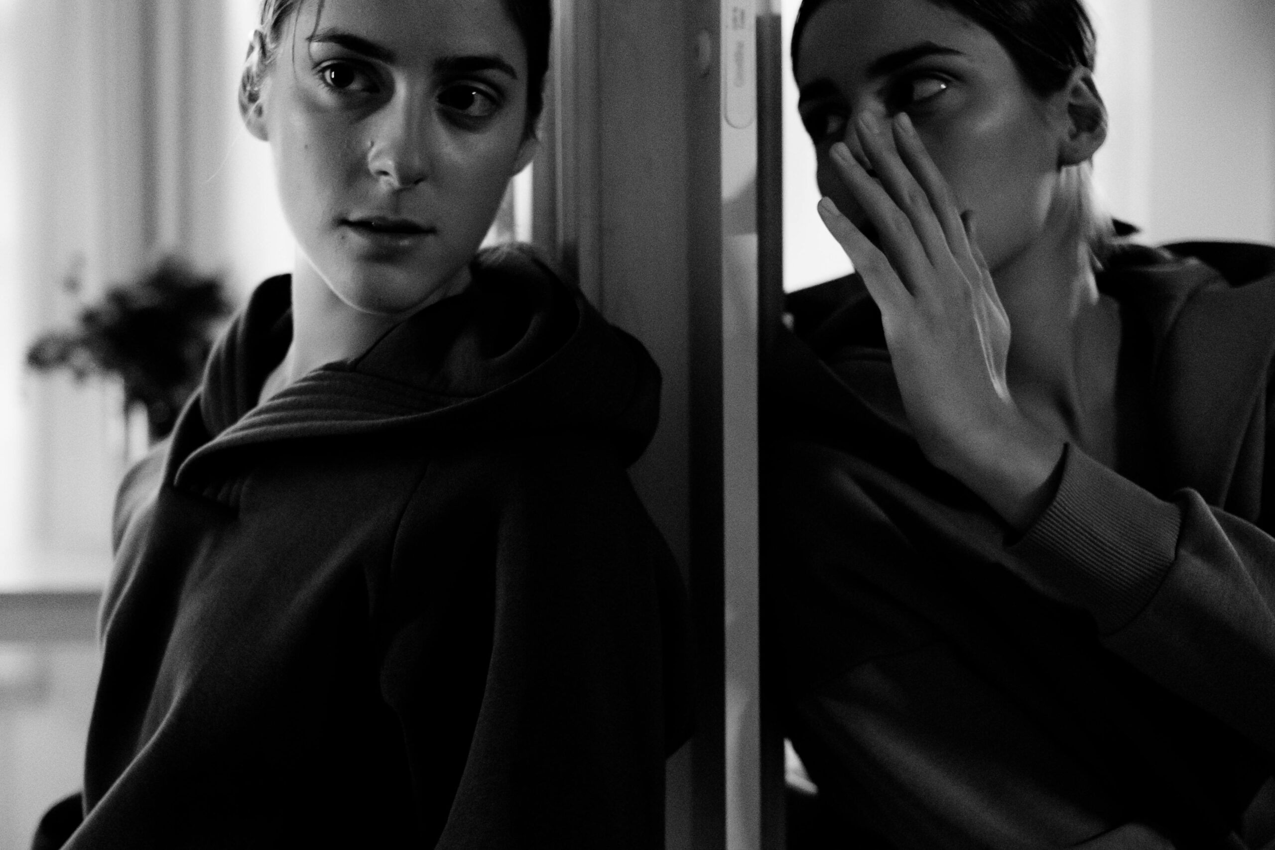 woman talking to another woman by a door